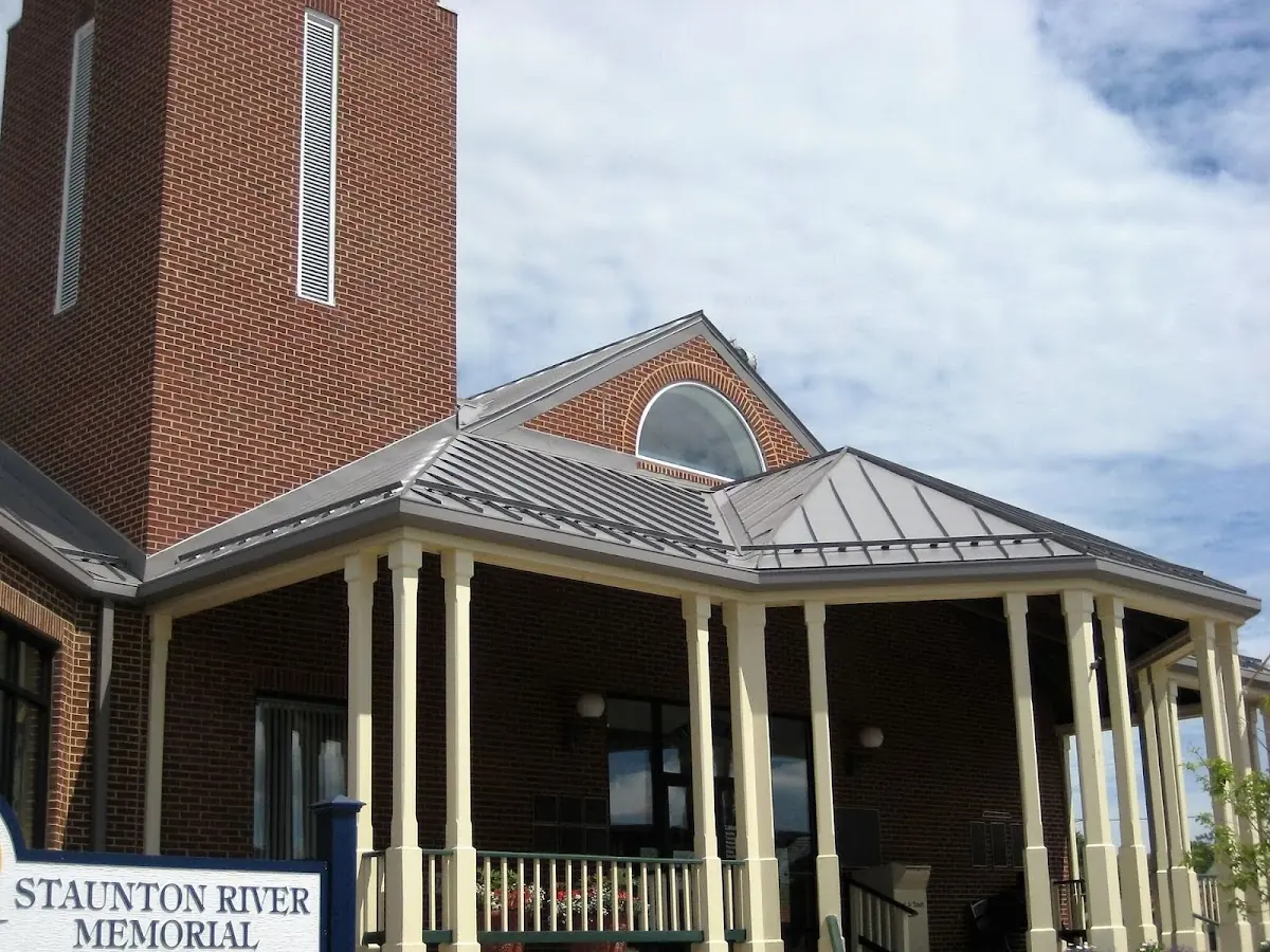 Skilled roofing craftsmen working on a residential roof in Beula